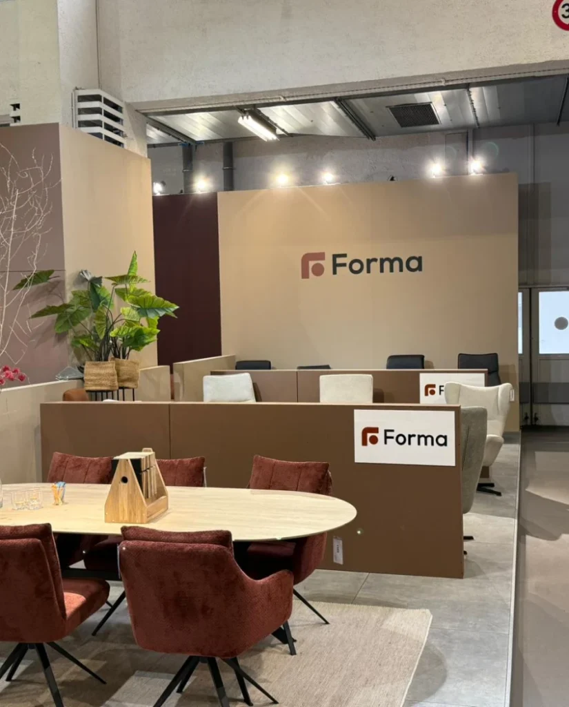 Forma showroom and office area with a round table and the Forma logo