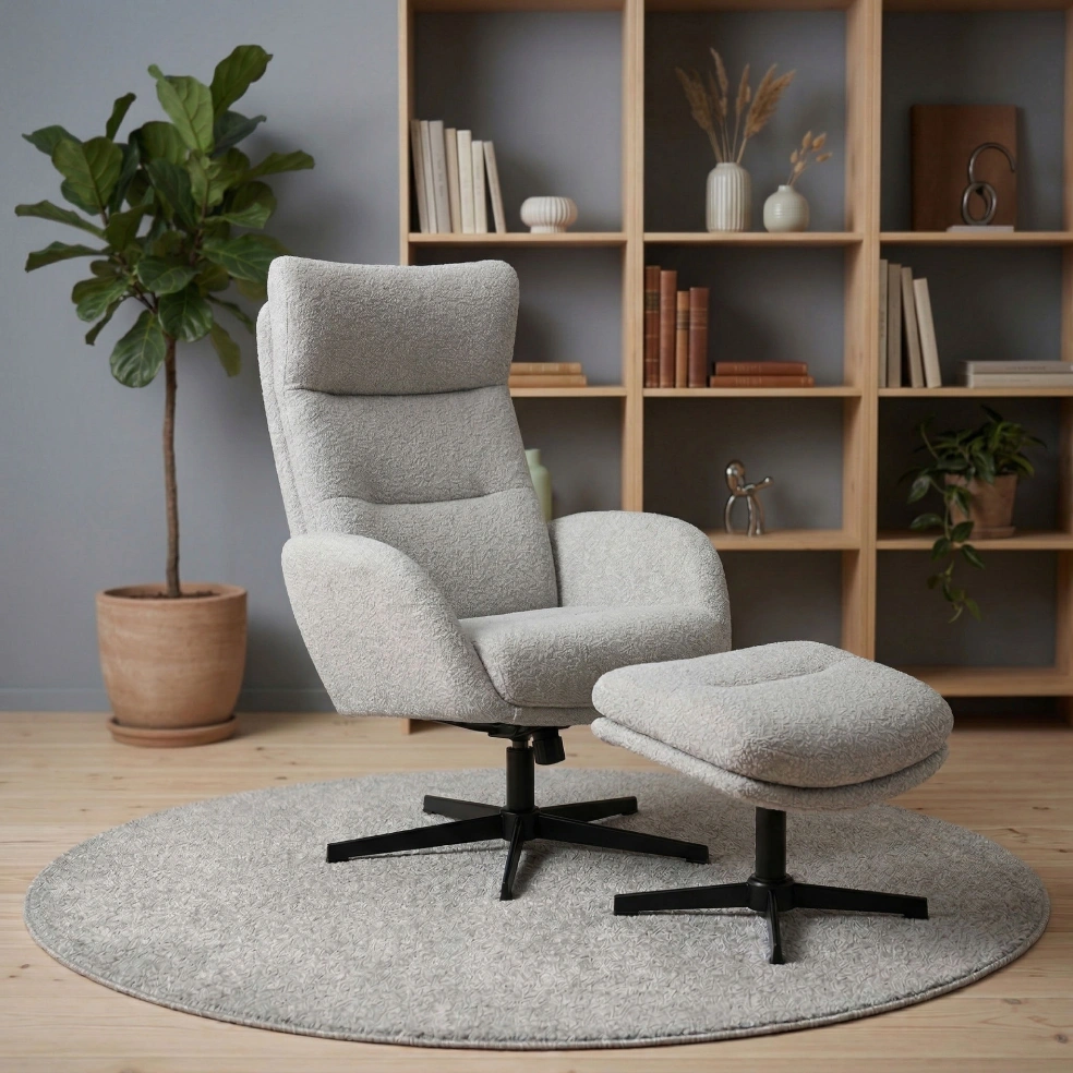 Grey recliner chair with footstool in a styled living room