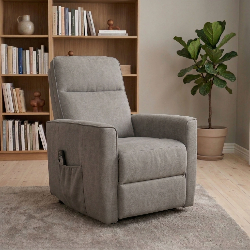 Grey recliner armchair in a styled living room with shelves