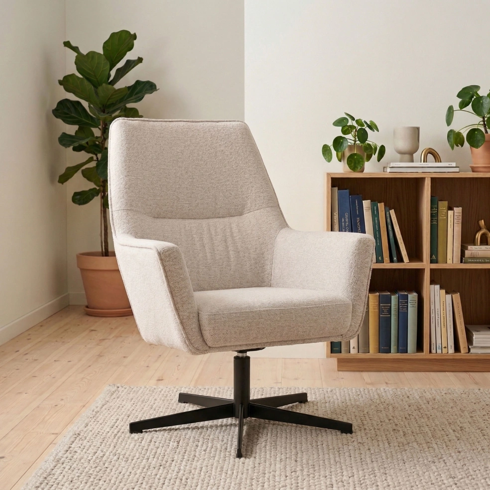Cream swivel armchair in a styled living room with shelves